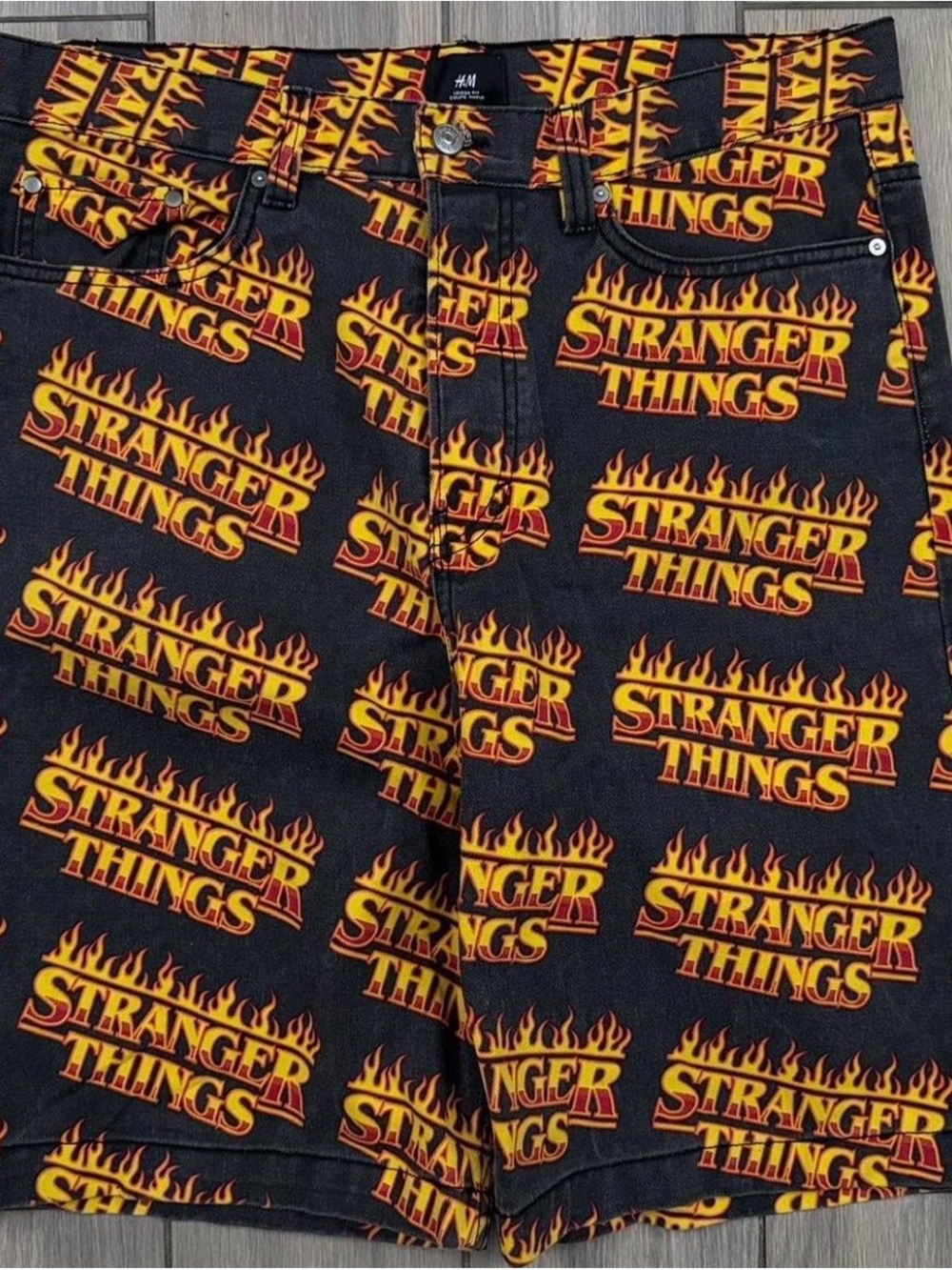 Stranger Things H&M Black Shorts with Yellow and Orange Flame Logo